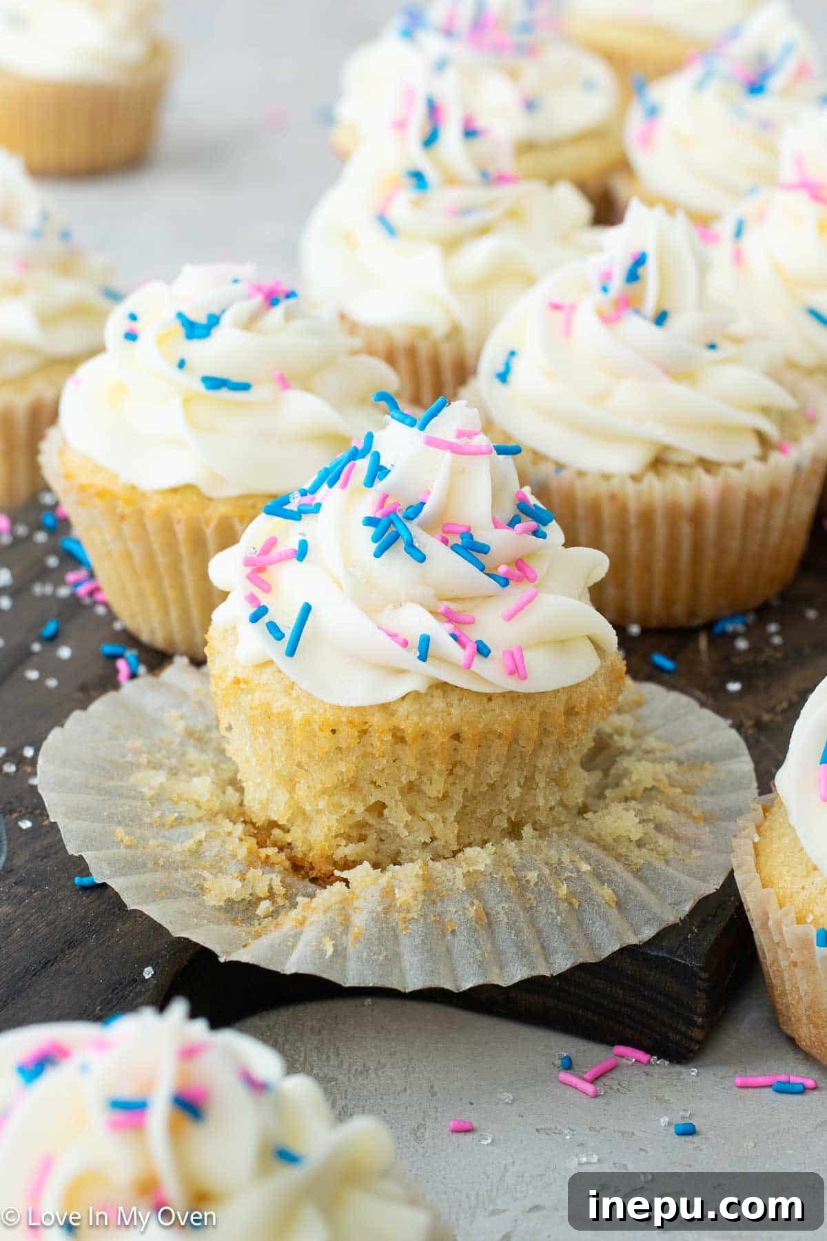 Sweet Gender Surprise 3 Delicious white chocolate gender reveal cupcakes filled with a surprise colored frosting, perfect for a baby shower or gender reveal party.