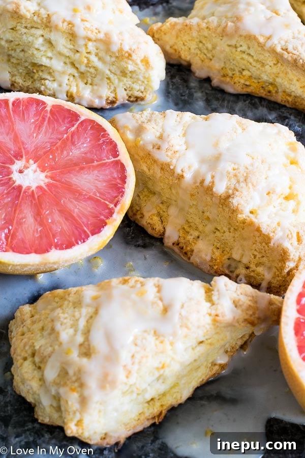 Zesty Grapefruit Scones 7 A stack of golden Glazed Grapefruit Scones, ready to be enjoyed
