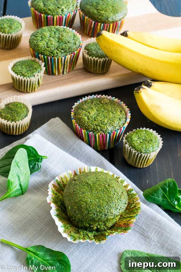 Emerald Monster Muffins 7 A stack of green monster muffins with a charming presentation, ideal for parties or snacks.