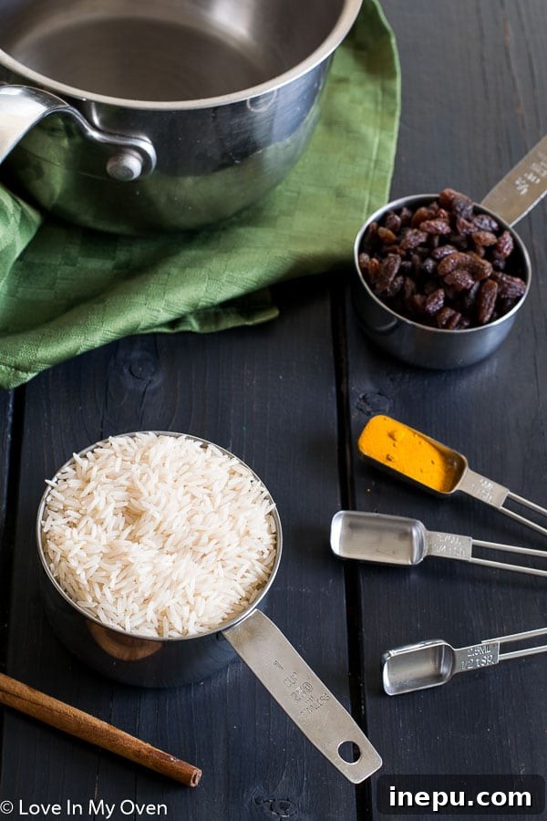 Cape Malay Golden Rice 4 A dish of freshly cooked South African Yellow Rice with the ingredients visible, highlighting its texture and warmth.