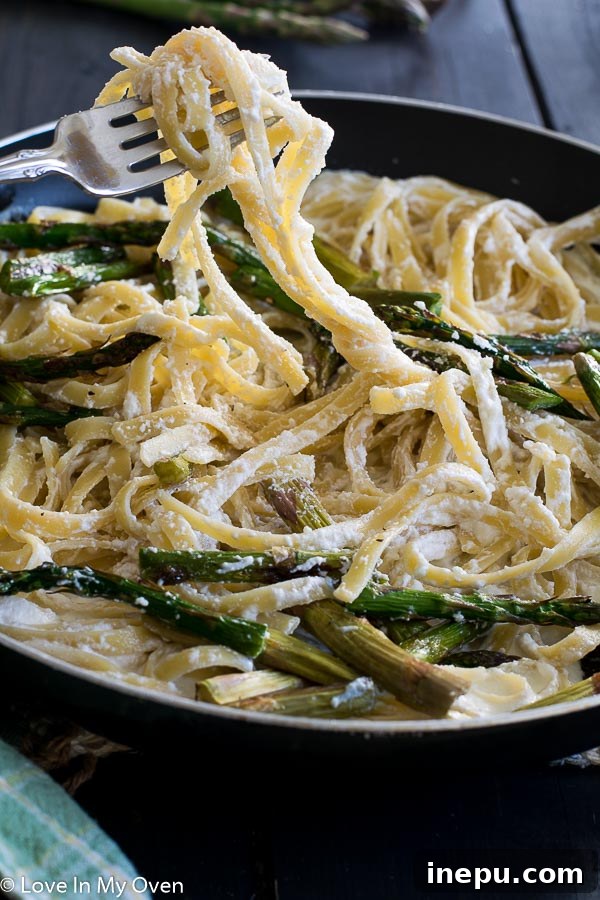 Golden Roasted Asparagus Pasta 6 Overhead shot of roasted asparagus and ricotta fettuccine on a table