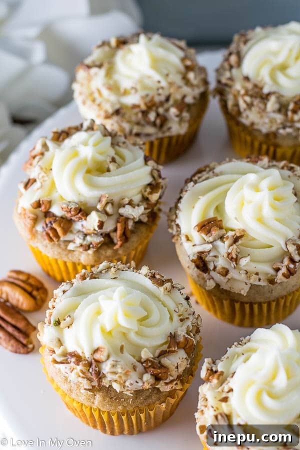 Perfectly Spiced Carrot Cupcakes 8 A Stack of Perfectly Frosted Carrot Cake Cupcakes