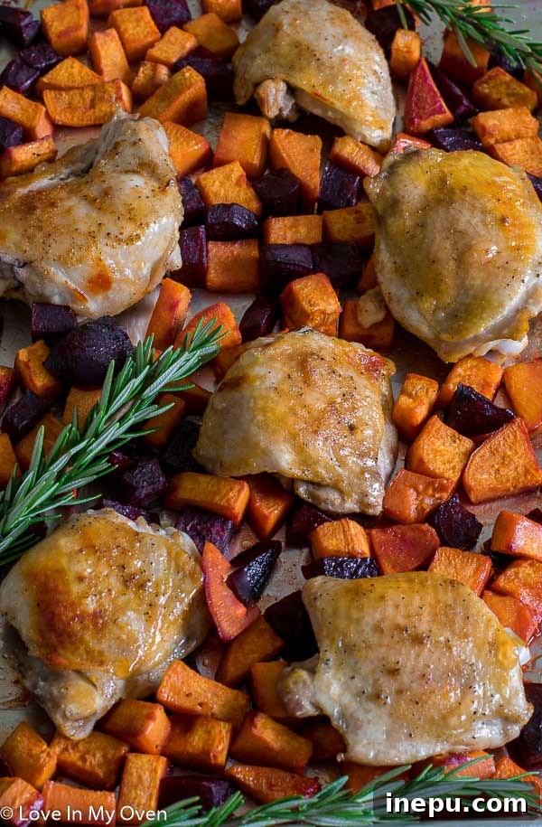 Sweet & Earthy Sheet Pan Chicken Dinner 2 Sheet Pan Chicken with Sweets n Beets - perfectly roasted chicken thighs, sweet potatoes, and beets on a baking sheet