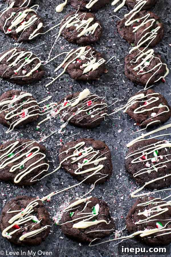 Close-up of Mint Chocolate Candy Cane Cookies with white chocolate drizzle