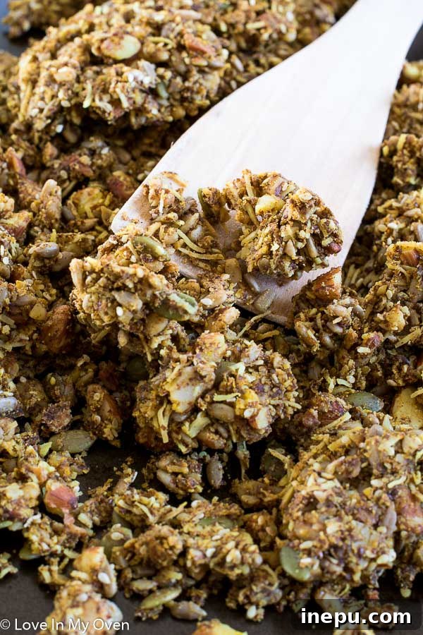 Delicious homemade grain-free granola, scattered with nuts and dried fruits, ready for a healthy breakfast or snack.