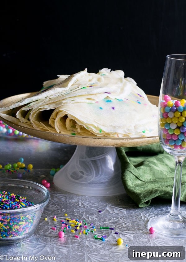 Rainbow Sprinkle Crepe Tower 4 stacked funfetti crepe cake