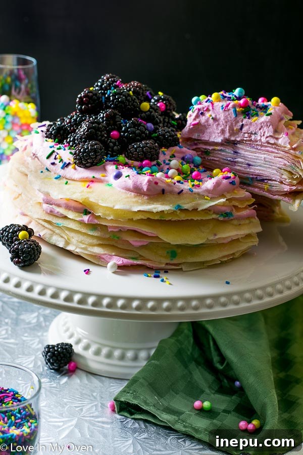 Rainbow Sprinkle Crepe Tower 5 funfetti crepe cake on cake stand